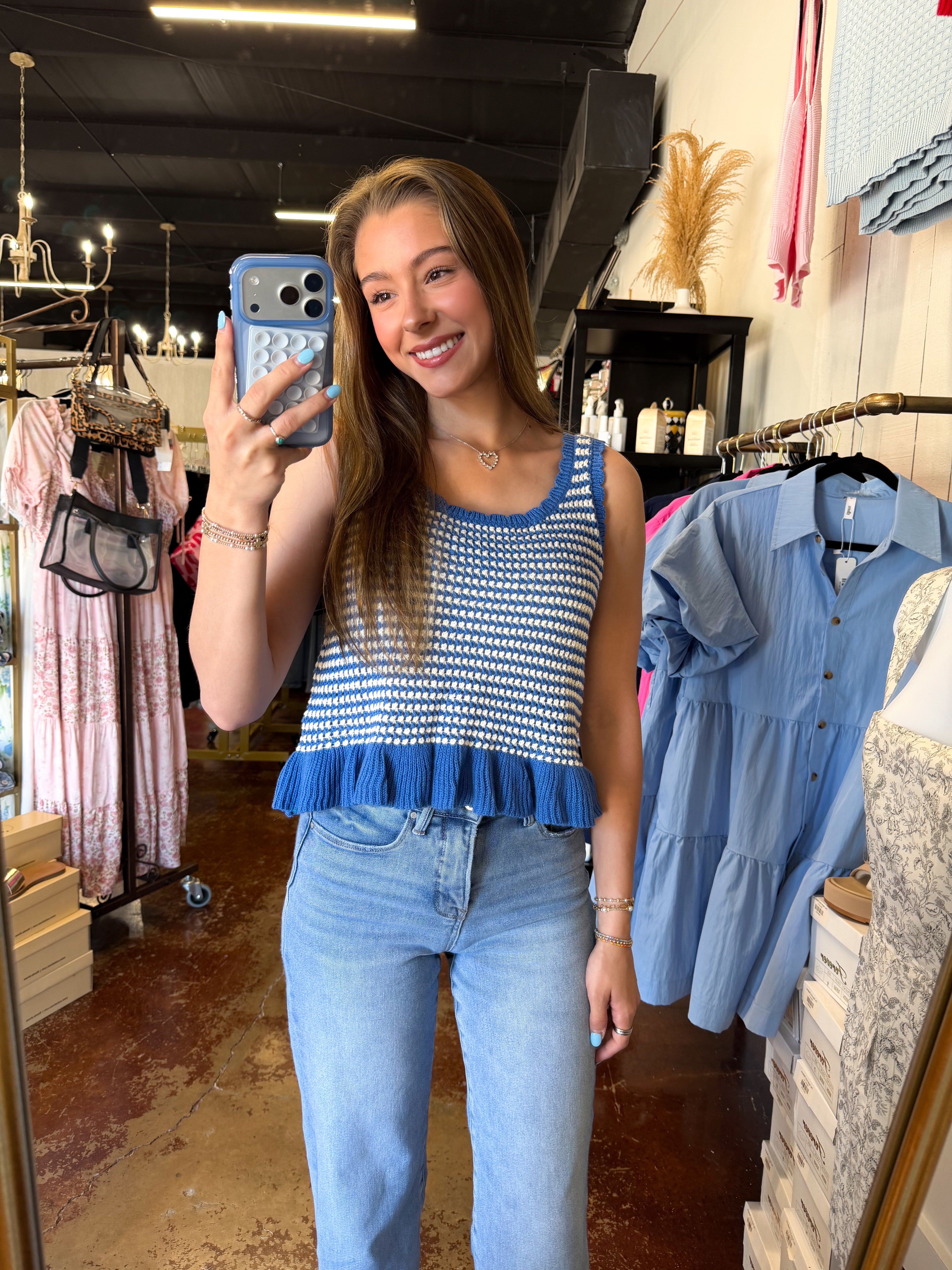 The Blue Sleeveless Ruffle Knit Top